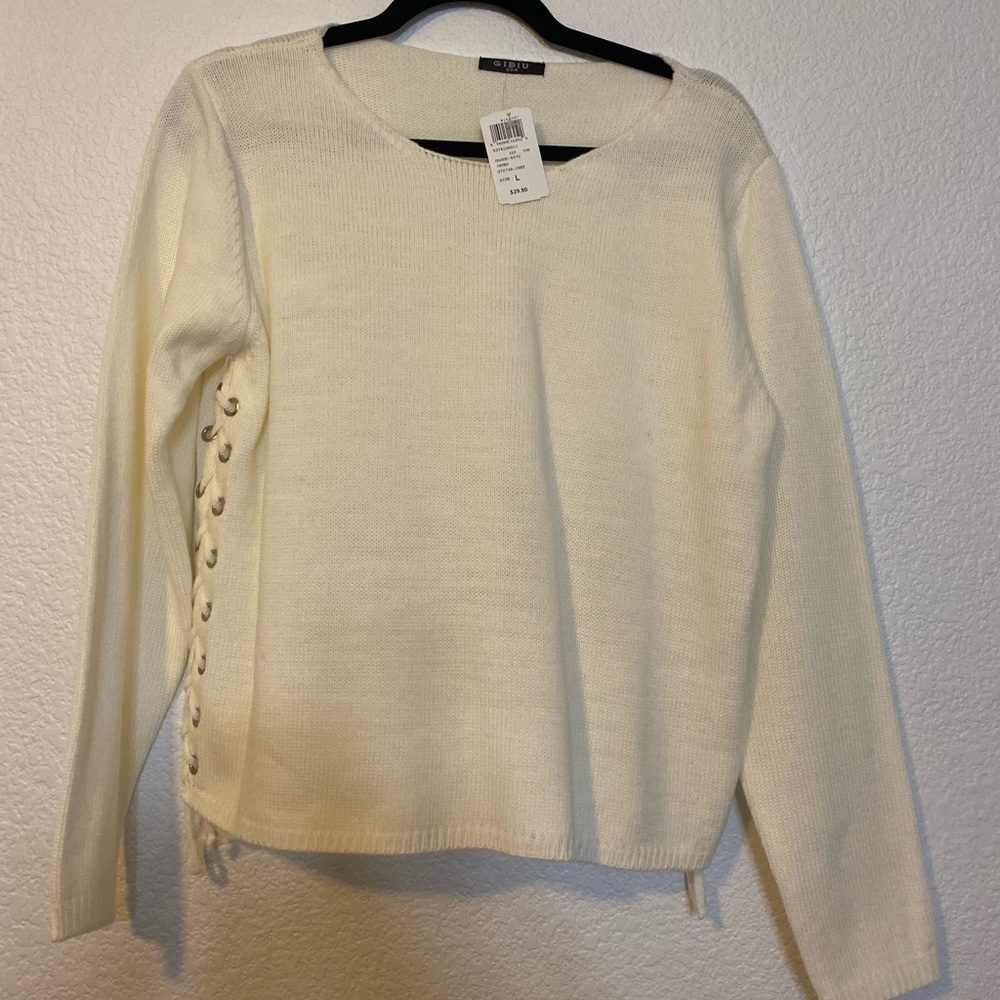 White sweater with lace string ties on side